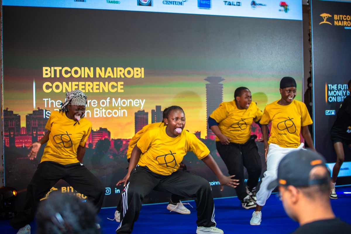 The team celebrating on stage